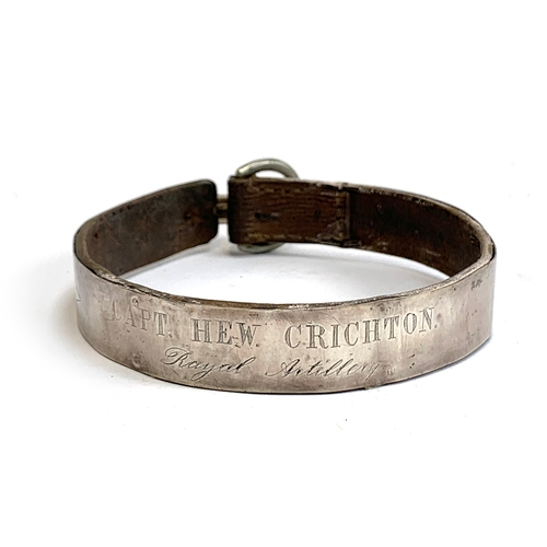 150 - A leather and silver mounted dog collar, engraved 'Capt. Hew. Crichton, Royal Artillery', with thee ... 