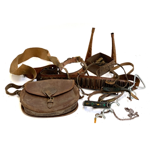 203 - A mixed lot to include dog collars, cartridge belt, cartridge bag, two copper horns, etc