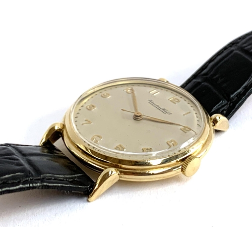 13 - An IWC Schaffhausen gent's 18ct gold wrist watch, the frosted silver dial with applied gold Arabic n... 