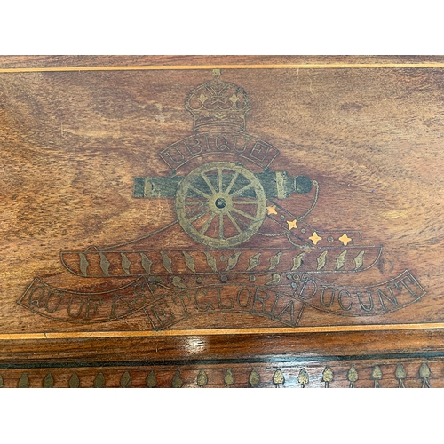 653 - An Indian Hoshiarpur hardwood and brass inlaid tray of the Royal Artillery, inlaid with a cannon and... 