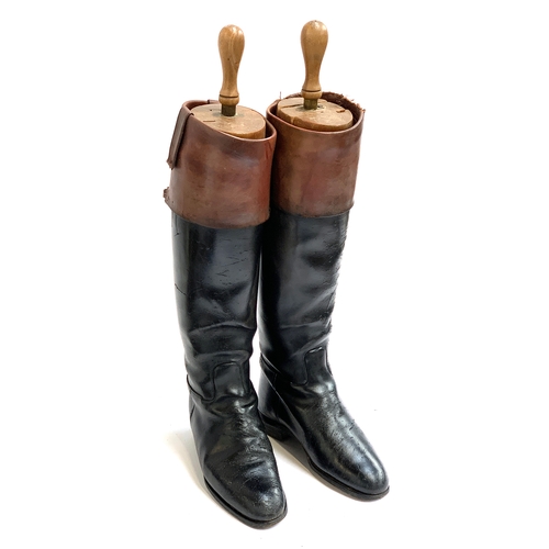 808A - A pair of black leather hunting boots, approx. size 8, with later added mahogany tops, full wooden t... 