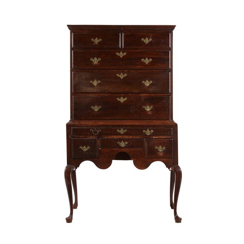 573 - An American mahogany and stained pine chest on stand, mid 18th century, the chest with two short and... 