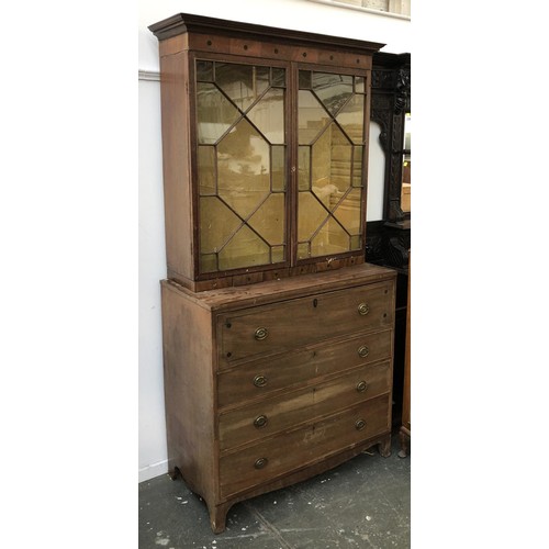 933 - A Regency mahogany astragal glazed secretaire bookcase with fitted interior, over a further three dr... 