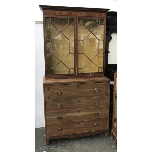 933 - A Regency mahogany astragal glazed secretaire bookcase with fitted interior, over a further three dr... 