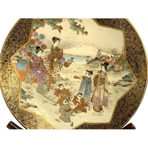 63 - A pair of Japanese satsuma plates depicting women and children with Mt Fuji in backgrounds, profuse ... 