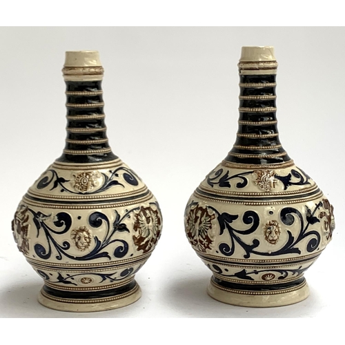 64 - A pair of Italian glazed stoneware vases with scrolling design, 24.5cmH