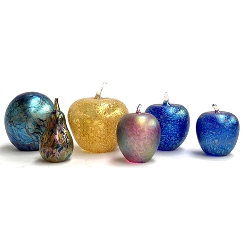 71 - Four iridescent art glass apple paperweights, a similar pear, and an art glass egg by Juliet James, ... 