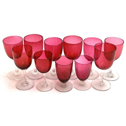 89 - Eleven hand blown clear stemmed cranberry glasses (11)