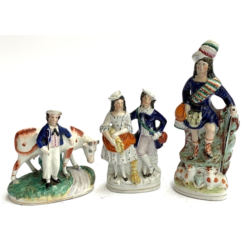 102 - Three Staffordshire flatbacks: boy with cow, courting couple, and a highlander, the tallest 27cmH (3... 