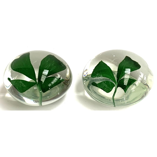 121 - Two glass paperweights with four leaf clover design, 7cmD