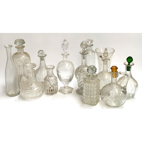 130 - A mixed lot of decanters to include hourglass decanter; Costa Sweden etc