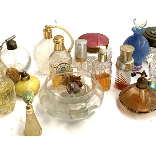 131 - A collection of scent bottles, some art deco, to include Dior, Peter Tysoe Glass, etc