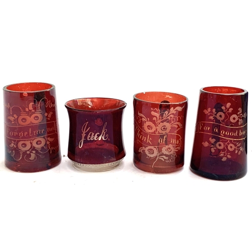 139 - Four Victorian cranberry glass mugs, inscribed 'Jack', 'For a Good Boy', 'Think of Me', and 'Forget ... 