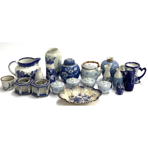 140 - A mixed lot of blue and white, mainly Oriental ceramics, to include ginger jar, sake bottles, teapot... 