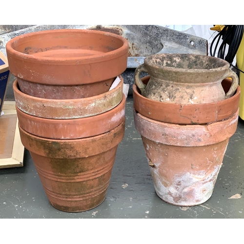 935 - Six terracotta plant pots, each approx. 28cmD; together with a twin handled urn