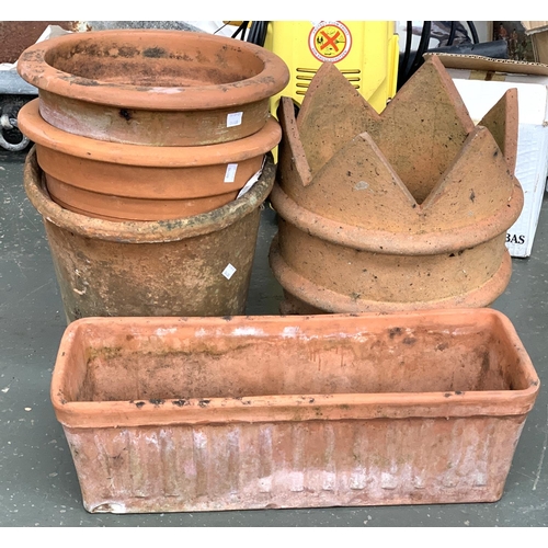 937 - Three large terracotta plant pots, each approx. 33cmD; together with a chimney and a terracotta trou... 