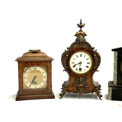 49 - Four mantel clocks, to include a French slate clock; a Kundo clock in glass case; a french style gil... 