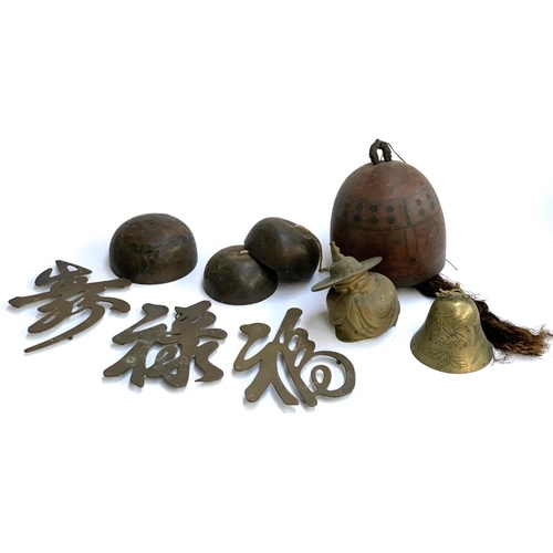 283 - Three Chinese copper bells, together with one other larger; a further brass bell; brass figure of a ... 