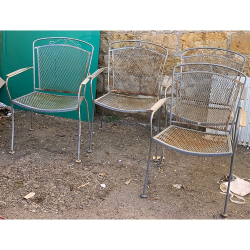 955 - A set of four metal garden chairs