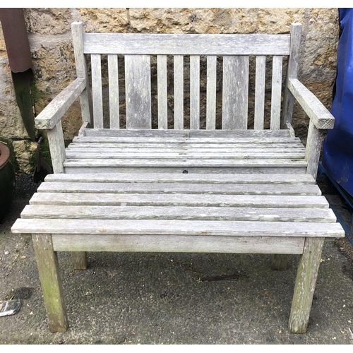 940 - A G W Bro slatted garden table, together with garden bench, the bench 112cmW