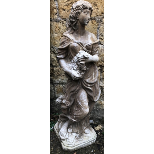 948 - A composite stone garden statue of a lady with flowers, 120cmH