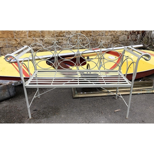 956 - A collapsible painted metal garden bench with scrolled arm supports, 140cmW