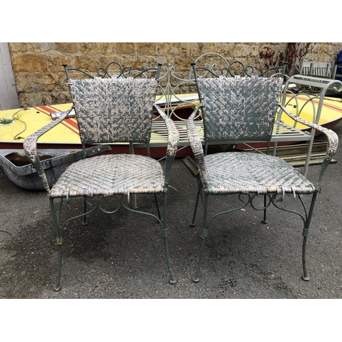 960 - A pair of metal and wicker garden chairs