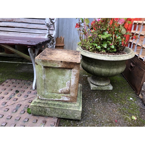 964 - A composite stone garden urn on stand, together with a two piece composite plinth, 40cmH