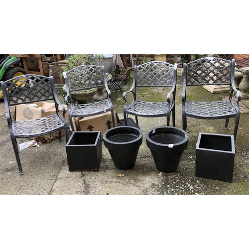 973 - A set of four metal garden chairs, together with 4 composite planters