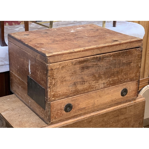 A vintage pine storage box, with compartmented drawer below, bears