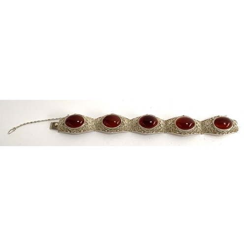 5 - An early 20th century Chinese export silver filigree bracelet set with carnelian cabochons, with saf... 