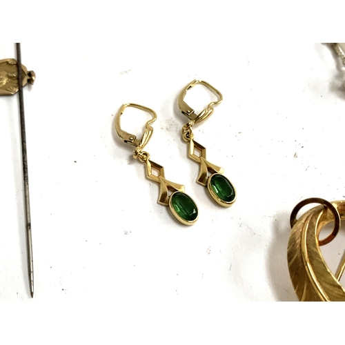 14 - A mixed lot to include a pair of gold tone and tourmaline earrings marked FB; an enamelled 1967 six ... 