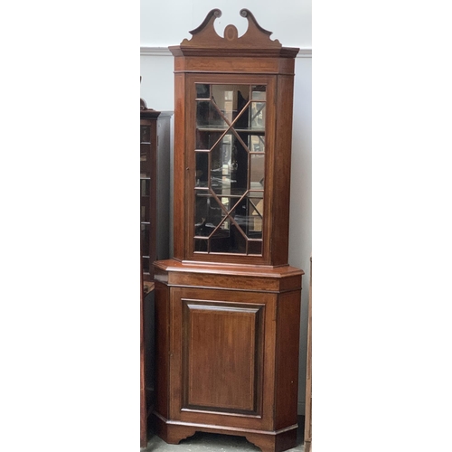 927 - A mahogany crossbanded glazed standing corner cupboard, 77cmW, 214cmH