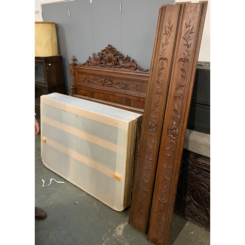 922a - A carved hardwood double bed, the headboard crested with dragons