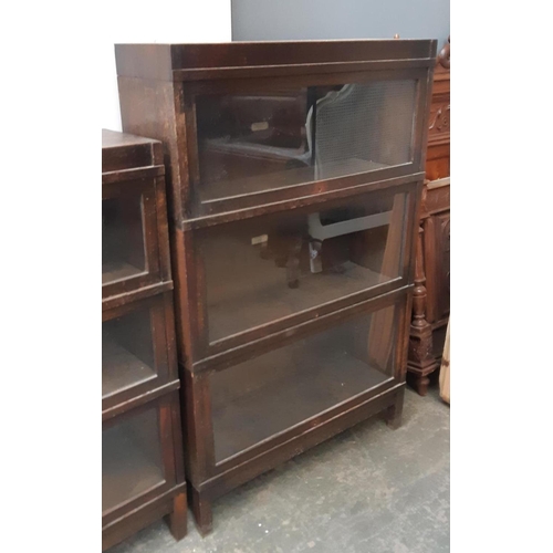 922 - An oak Globe-Wernicke four section bookcase, each section with plaque, 88x29x136cm