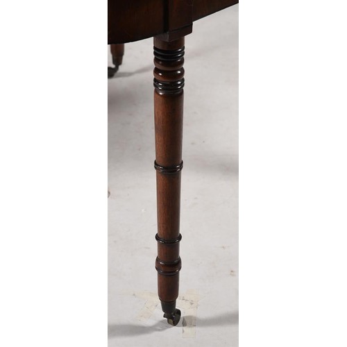 633 - A Regency mahogany and parcel ebonised extending dining table, c.1820, with three additional leaf in... 