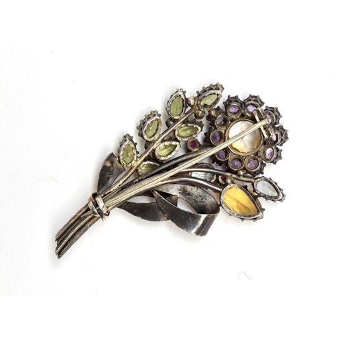 1 - Attributed to Dorrie Nossiter, a c.1930 Arts and Crafts gem set floral brooch, set with citrines, am... 