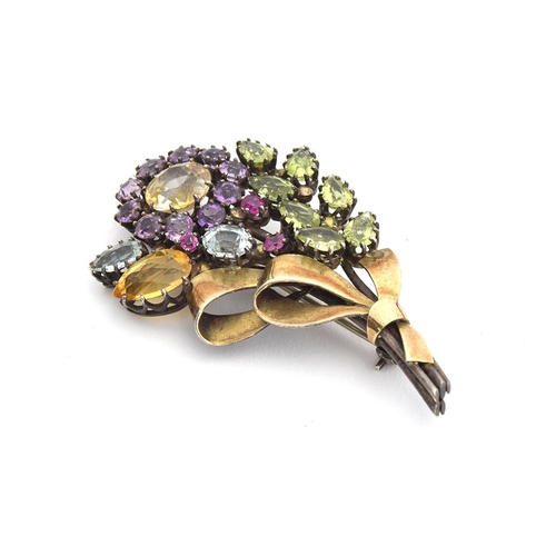 1 - Attributed to Dorrie Nossiter, a c.1930 Arts and Crafts gem set floral brooch, set with citrines, am... 