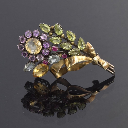 1 - Attributed to Dorrie Nossiter, a c.1930 Arts and Crafts gem set floral brooch, set with citrines, am... 