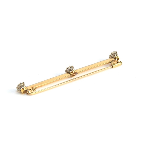 2 - An early 20th century gold and old brilliant cut diamond set knife edge bar brooch, tests as at leas... 