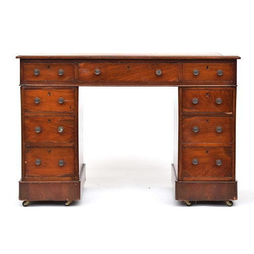 653 - A Victorian mahogany pedestal desk, of neat proportions, the gilt tooled skiver over a traditional a... 