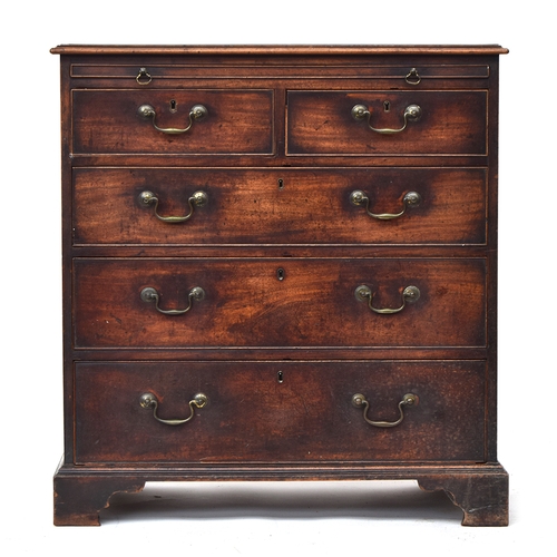 574 - A George III mahogany bachelors chest, crossbanded moulded top over a slide, with two short over thr... 