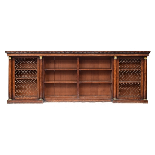 616 - A Regency mahogany break front bookcase, comprising four sections, with gadrooned pediment, the oute... 