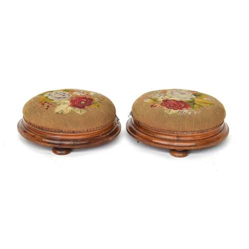 706 - A pair of Victorian walnut footstools upholstered in grospoint depicting roses, 35.5cm diameter

Pro... 