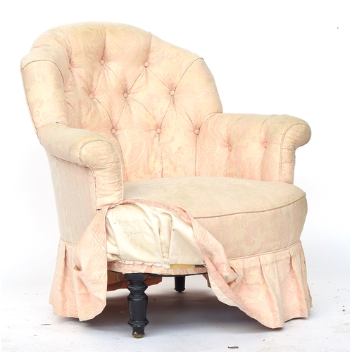 701 - A Victorian button back bedroom chair, upholstered in pink silk, on turned tapering ebonised legs wi... 