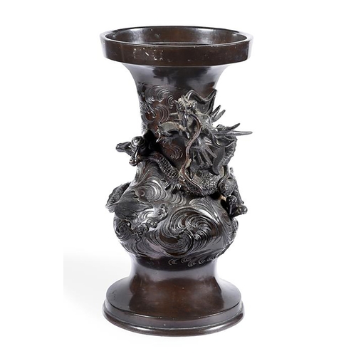 174 - A Japanese bronze vase cast with a dragon amongst clouds, the base inscribed with a four character m... 