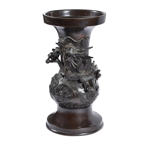 174 - A Japanese bronze vase cast with a dragon amongst clouds, the base inscribed with a four character m... 