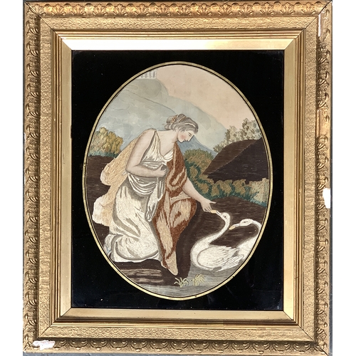 311 - A Georgian silk needlework picture of a Grecian lady beside a lake feeding swans, 29.5x23.5