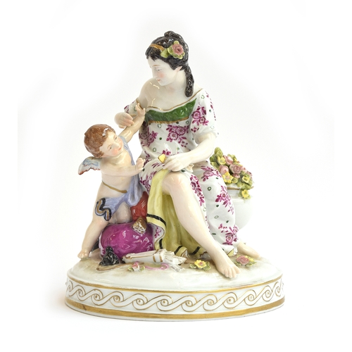 208 - A continental porcelain figure of a lady and cupid, crown mark to base, incised 1400, 21cm high