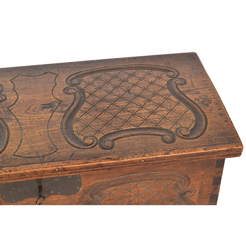 555 - A European carved coffer, carved with scrolled cartouches, 98cm wide, 49cm deep, 44cm high